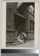 Man and woman examining paper, Eastman Annex, Rochester Institute of Technology