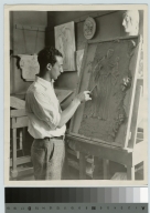 Unidentified student models a relief panel, Department of Applied and Fine Arts, Rochester Athenaeum and Mechanics Institute