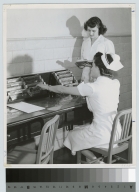 Academics, Food Administration student conferring with a nurse at Monroe County Hospital, 1942