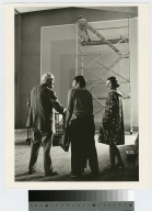 Josef Albers and two unidentified students talk in front of his "Homage to the Square"