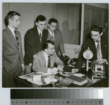 Student activities, five RIT Reporter staff members reviewing photographs [1952] [picture].
