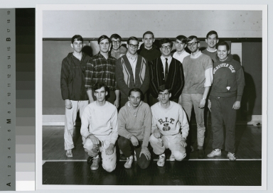 Student activities, group portrait of members of the Rochester Institute of Technology track team with their coach, Peter Todd, [1960-1968]