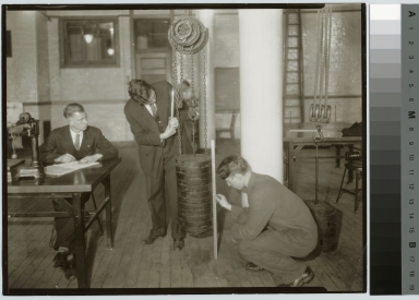 Unidentified students with chain hoist, School of Industrial Arts, Rochester Athenaeum and Mechanics Institute [1920-1935]
