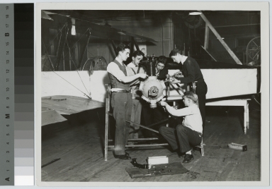 Students work on an airplane engine, School of Industrial Arts, Rochester Athenaeum and Mechanics Institute