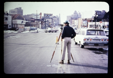 Surveyor in street
