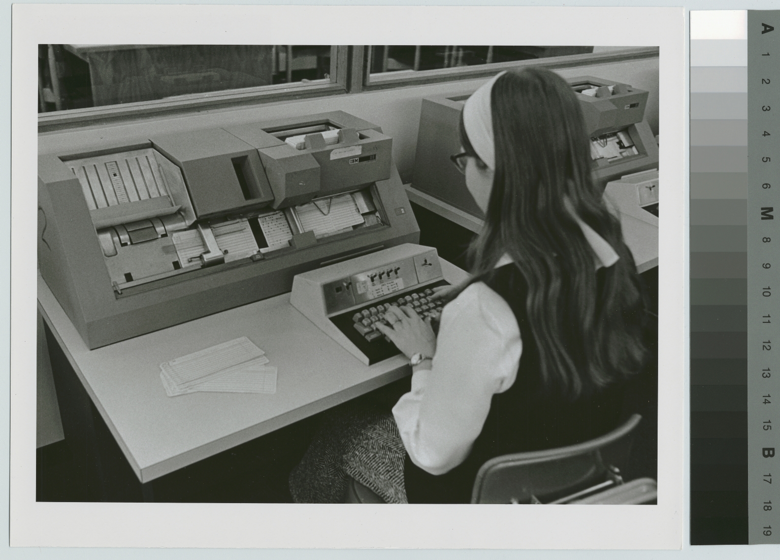 Unidentified student learns keypunch machine operation, Department of Computer Science, Rochester Institute of Technology