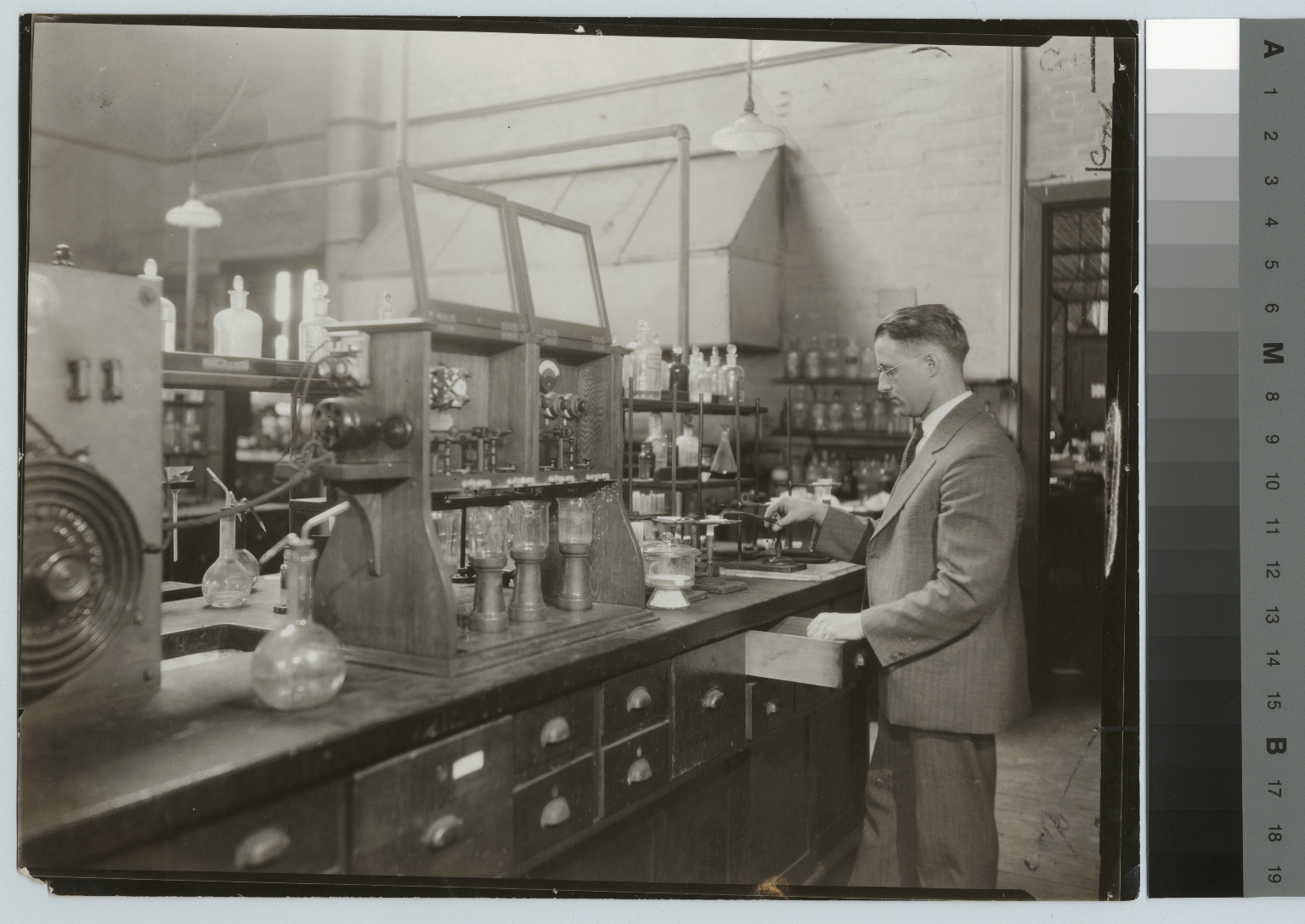 Academics, chemistry, Instructor Ralph Braden working on an experiment in a Rochester Athenaeum and Mechanics Institute chemistry laboratory, [1926-1927]