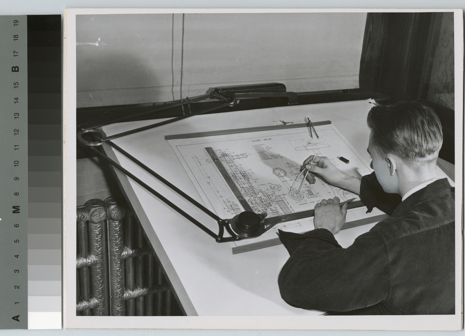 Unidentified student engaged in mechanical drawing, School of Industrial Arts, Rochester Athenaeum and Mechanics Institute [1920-1930]