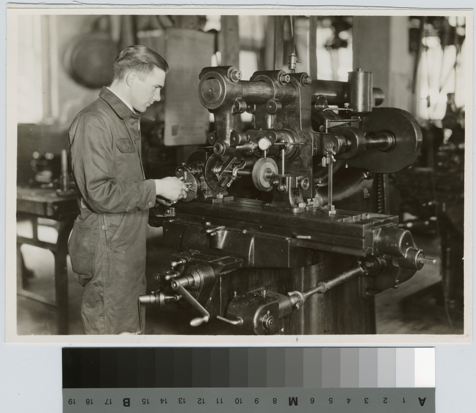 Unidentified student at milling machine, School of Industrial Arts, Rochester Athenaeum and Mechanics Institute [1926]