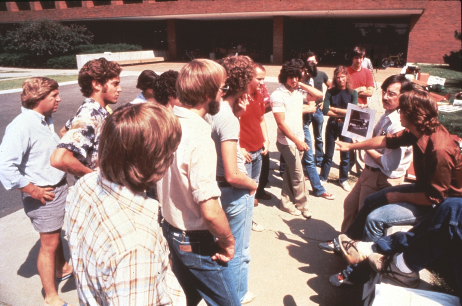 Students gather around professor for Class Outside